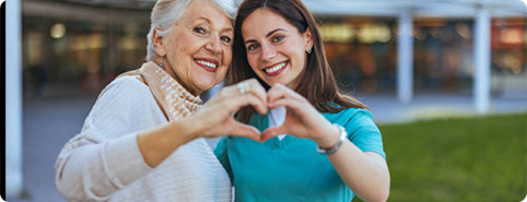 Caregiver supporting a patient with clinic-to-home health care delivery.