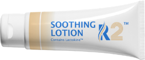 Tube of fragrance free Radiaderm R2™ Soothing Lotion with Lactokine™ milk protein for all skin types on its side.