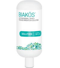 Bottle of BIAKŌS® Antimicrobial Skin & Wound Irrigation Solution to Irrigate and Remove Microbes from the Wound Bed to Elimate Planktonic, Imature and Mature Biofilms